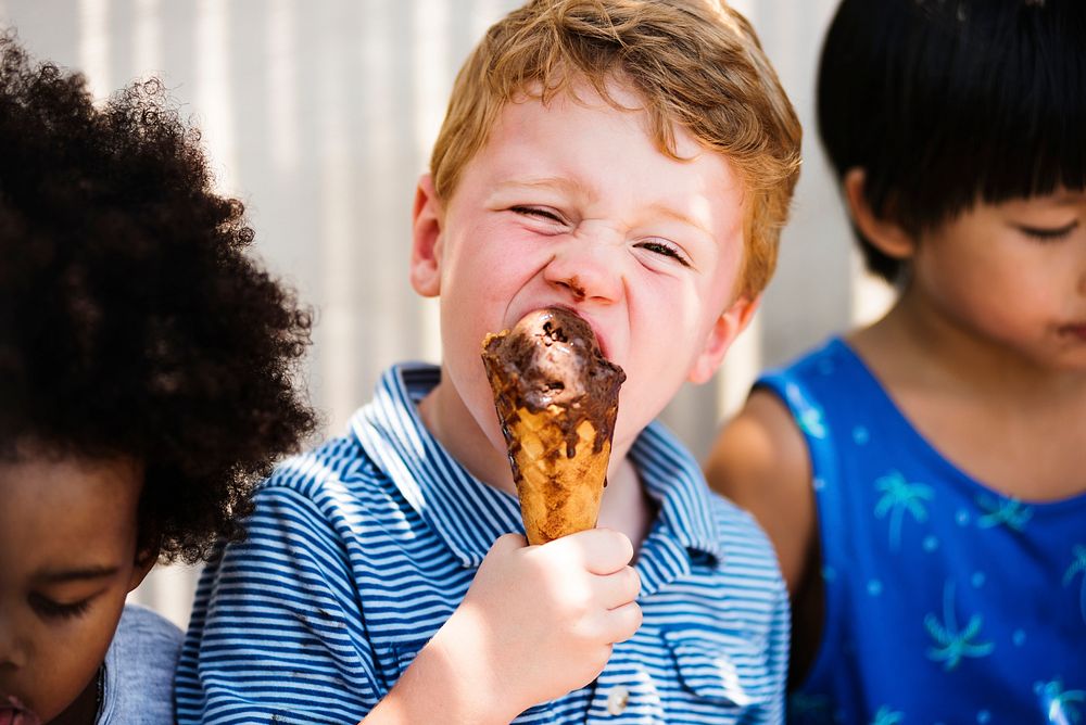 Little kids eating yummy ice cream