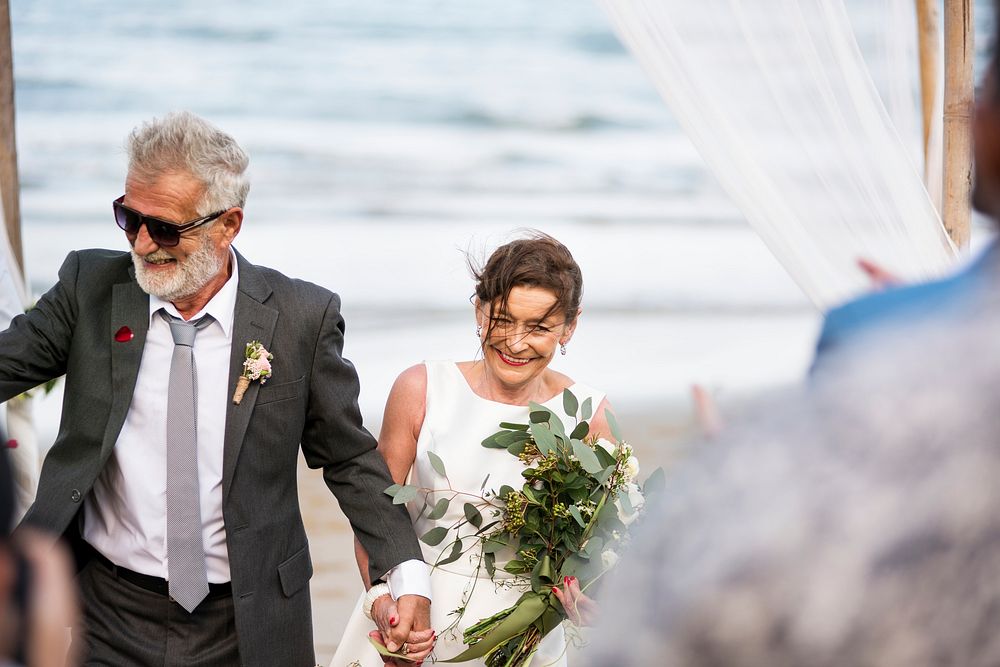 Senior couple at their beach wedding
