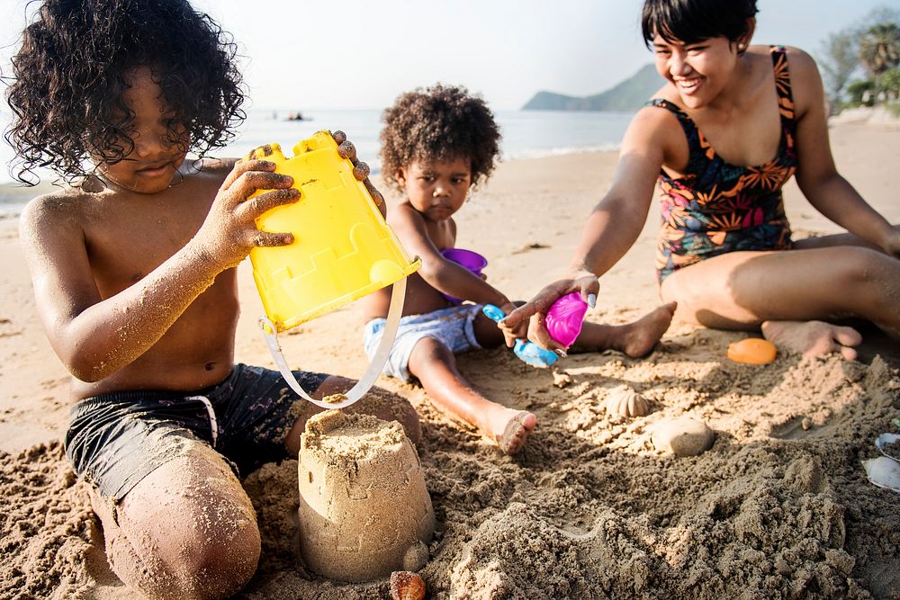 A family building sandcastles