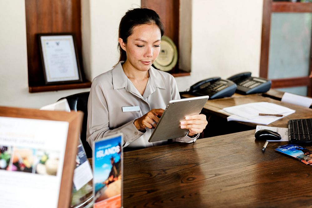 Receptionist working at the front desk