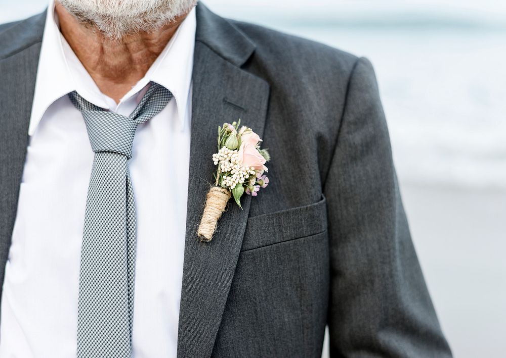 Mature groom getting married at the beach
