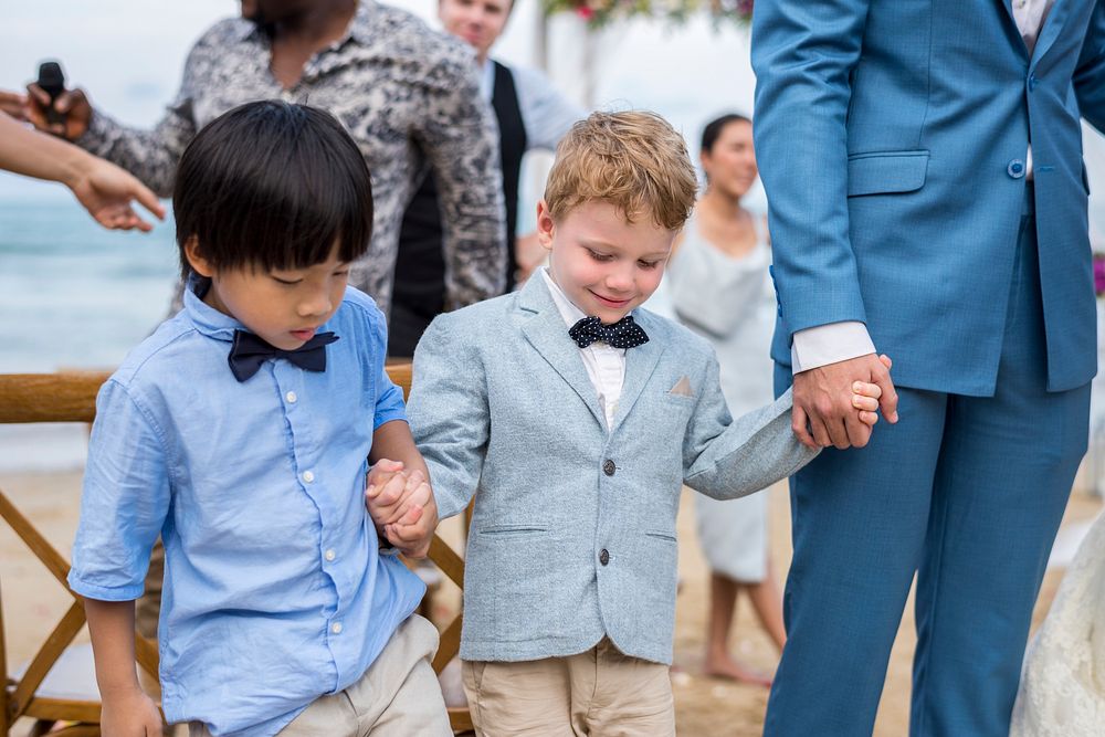 Two young boys at wedding ceremony