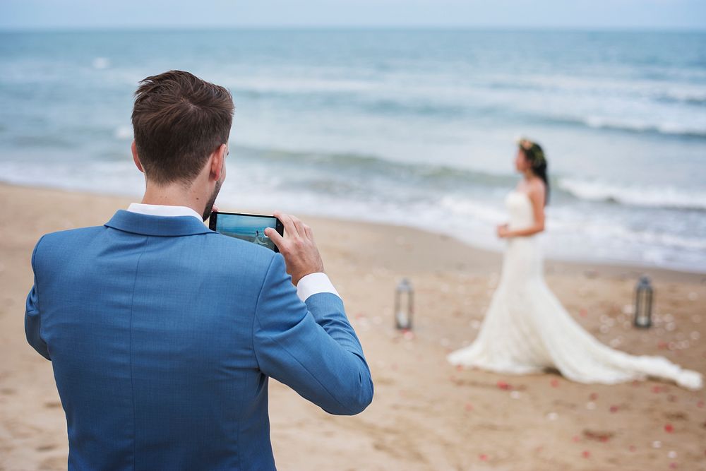 Young couple getting married at the beach