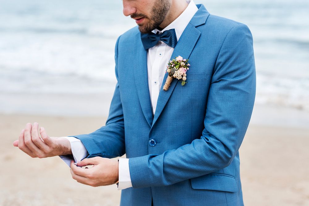 Handsome groom at the beach
