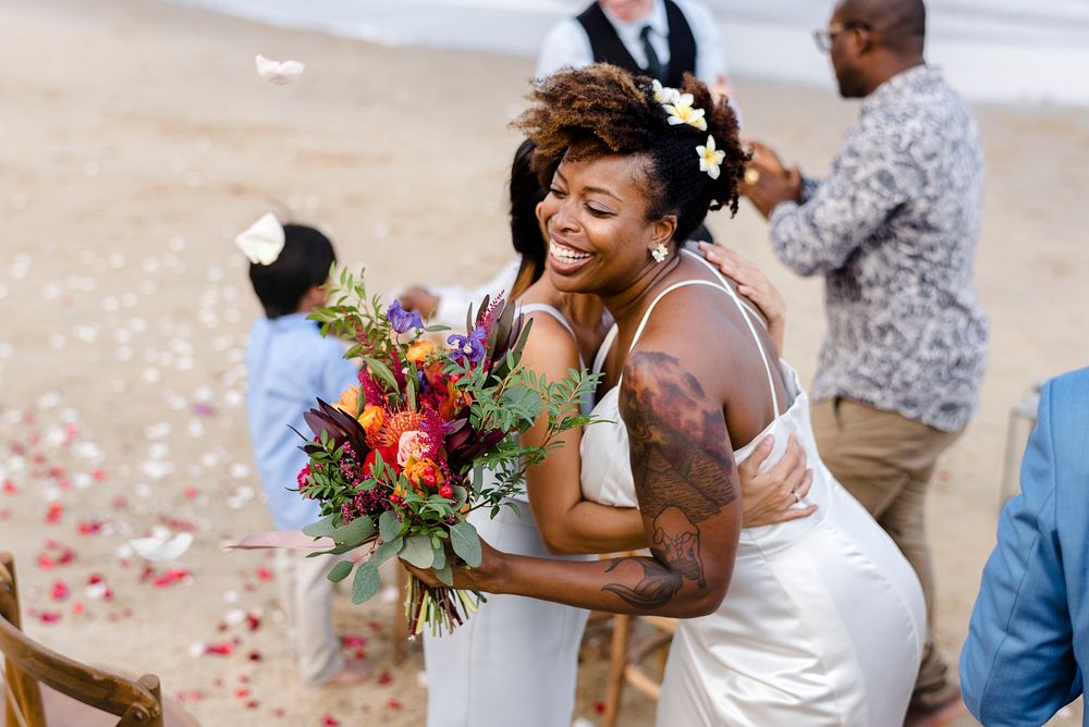 African American xouple getting married at the beach