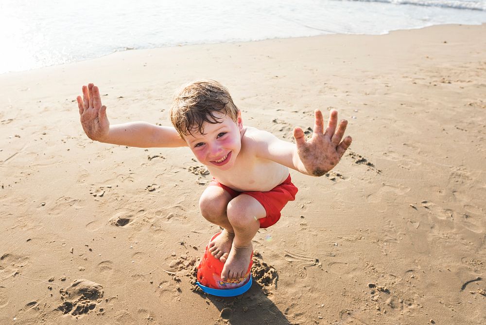 Little kid playing at the beach