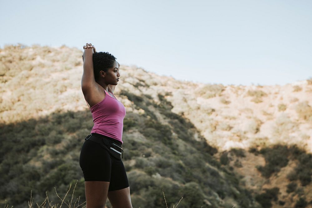 Woman stretching while on a hike