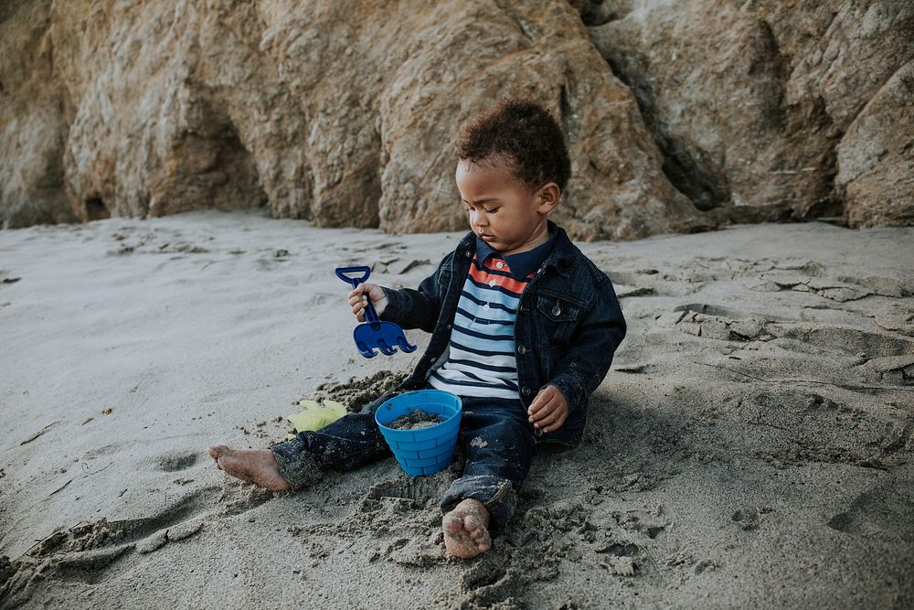 Little boy playing at a beach