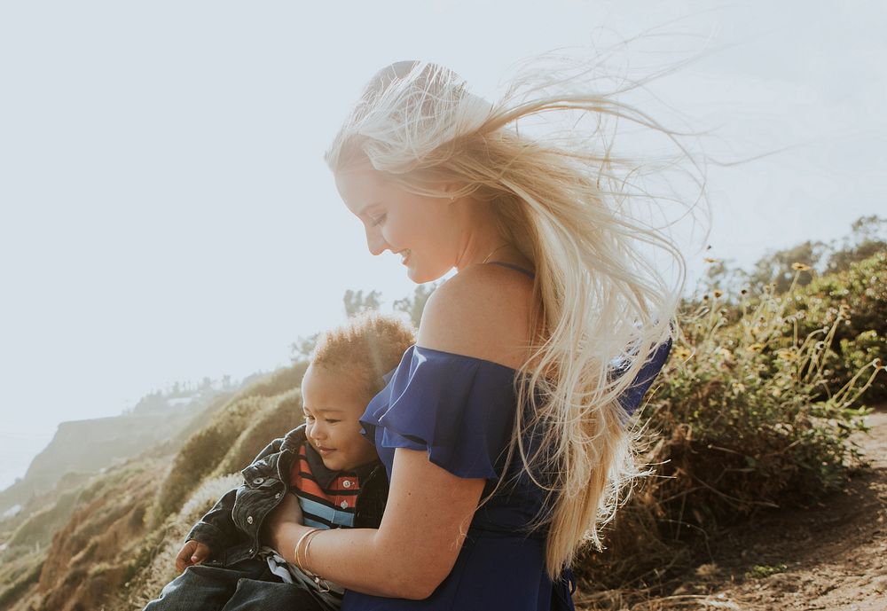 Blonde mom with her son outdoors