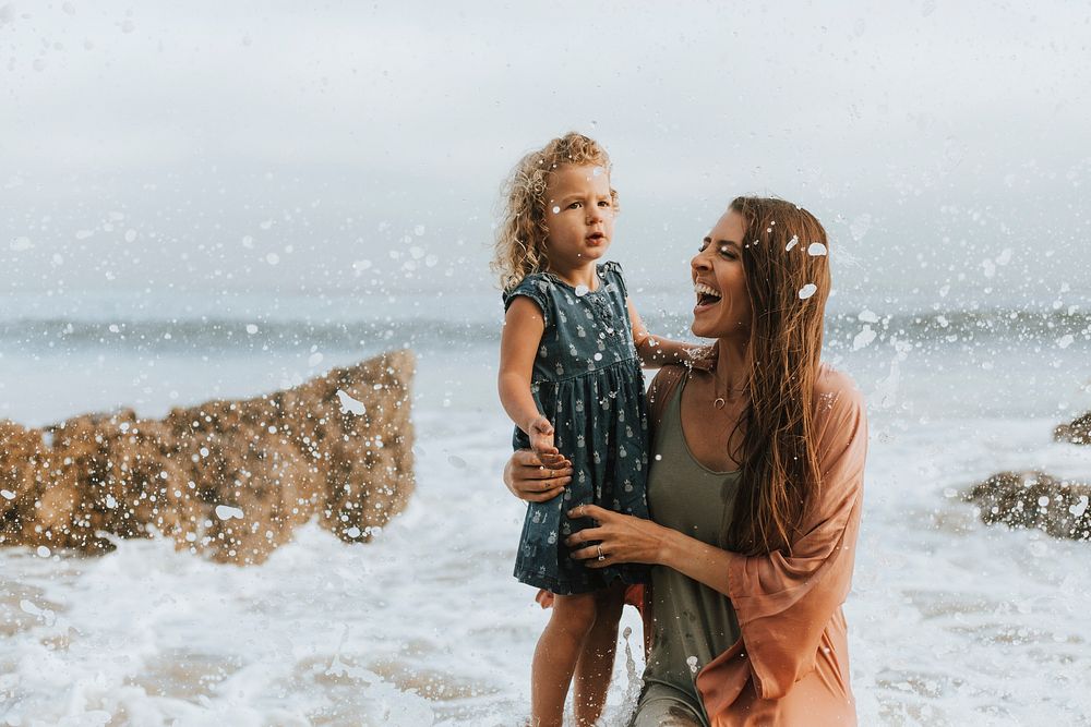 Mom with young daughter at a beach