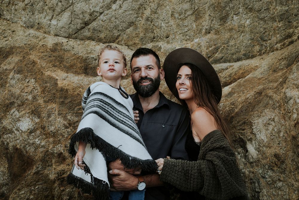 Family portrait with a big rock backdrop