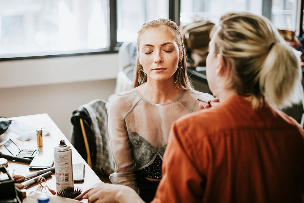 Model sitting down for her makeup