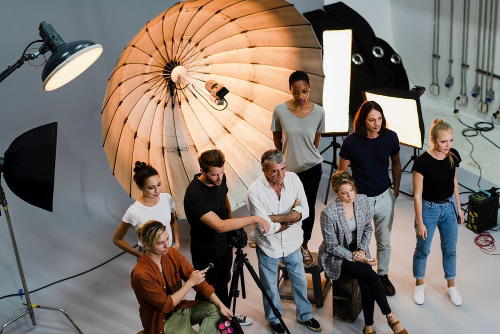People posing for a photo in a studio