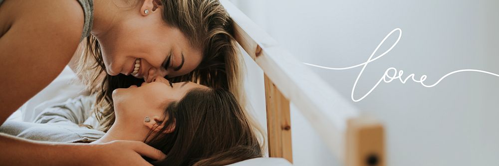 Lesbian couple kissing in the morning