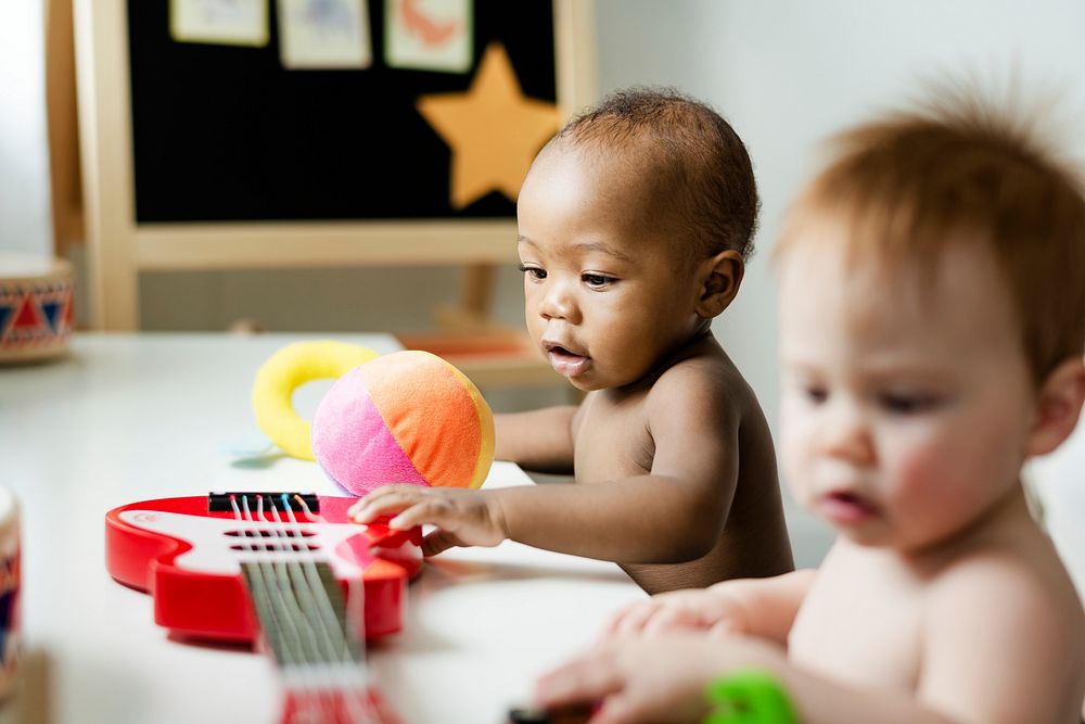 Babies playing with musical toys