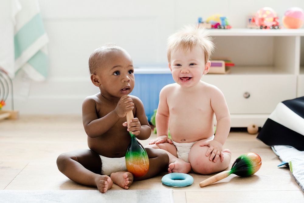 Babies playing together in a play room