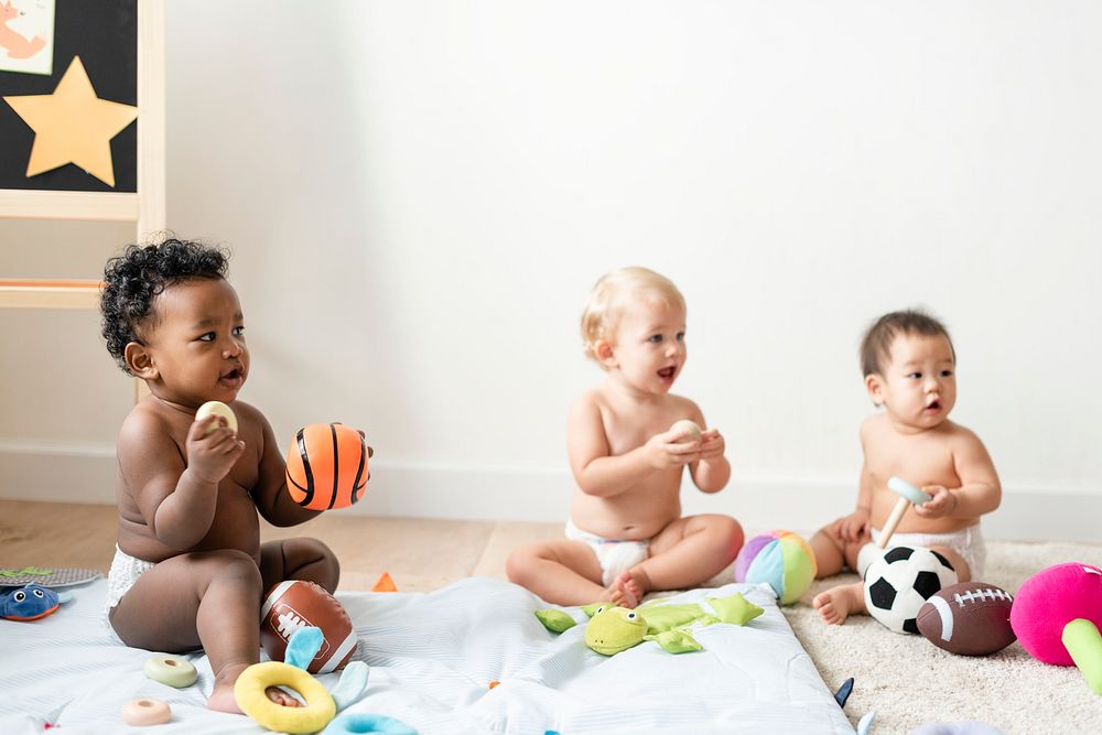 Babies in diapers playing together