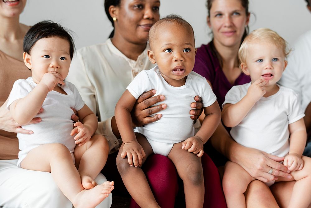 Diverse babies with their parents