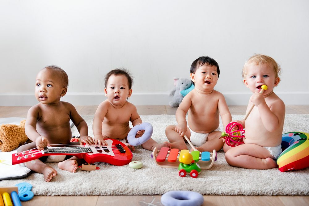 Babies playing together in a play room