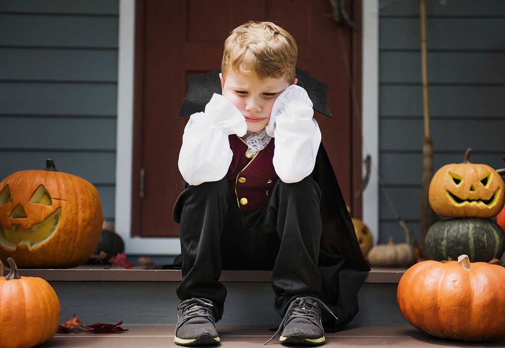 Sad boy in a Halloween costume