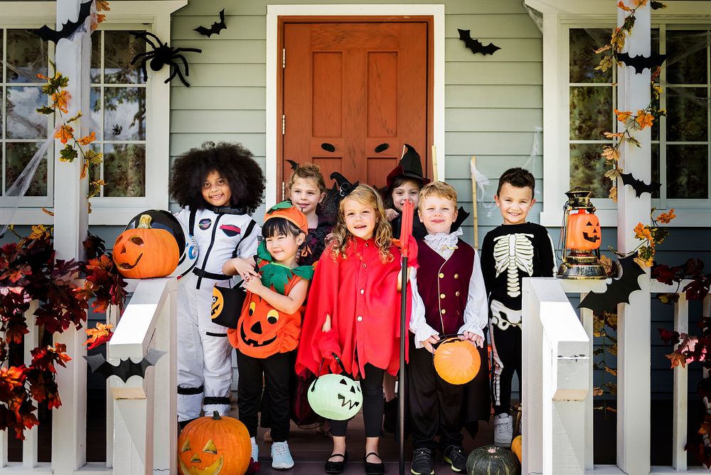 Little children in Halloween costumes