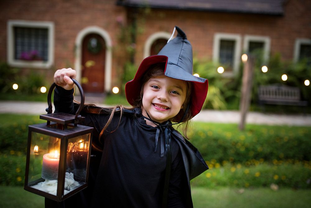 Little girl dressed up as a witch