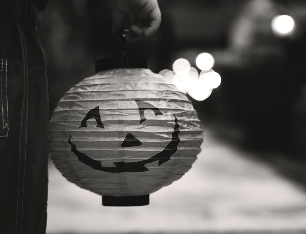 Little boy holding a Halloween lantern