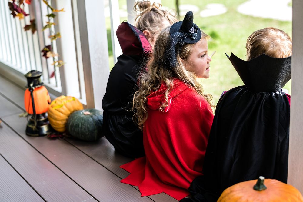 Little children trick or treating on Halloween