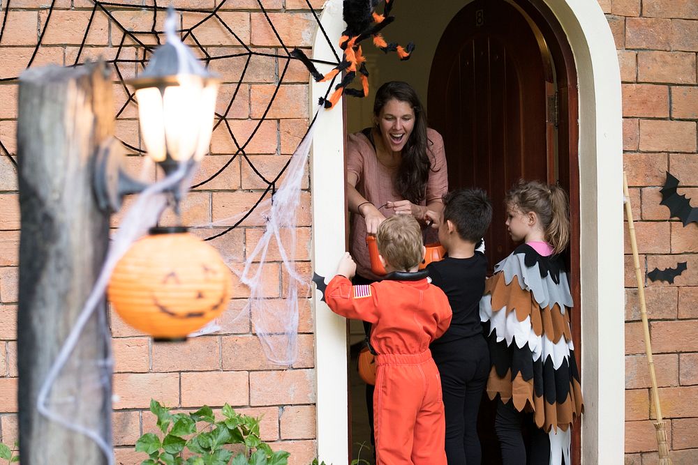 Little children trick or treating on Halloween