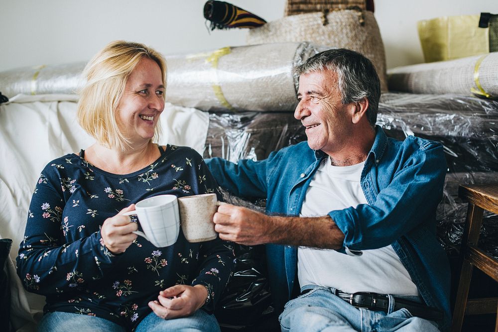 Couple celebrating by having a cup of coffee