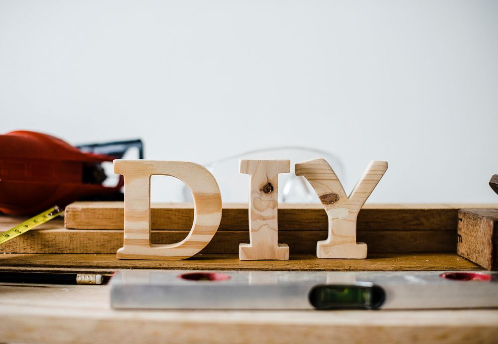 Wooden DIY sign with tools