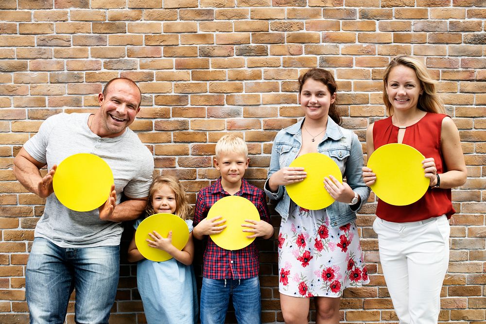 Family showing yellow round signs