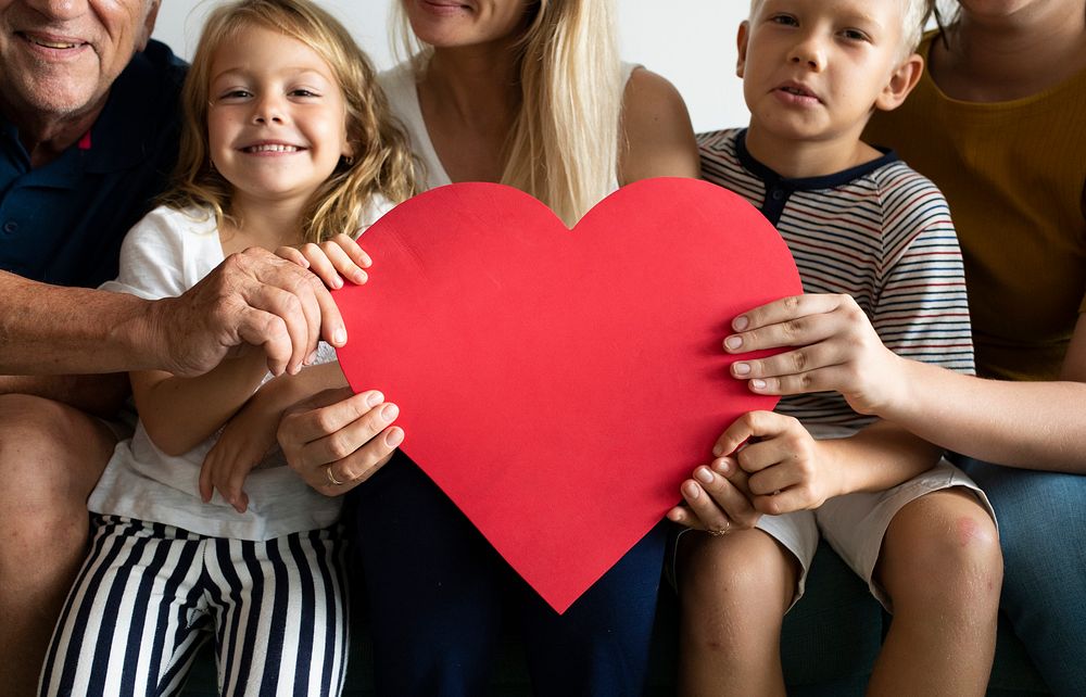 Family showing a red heart symbol