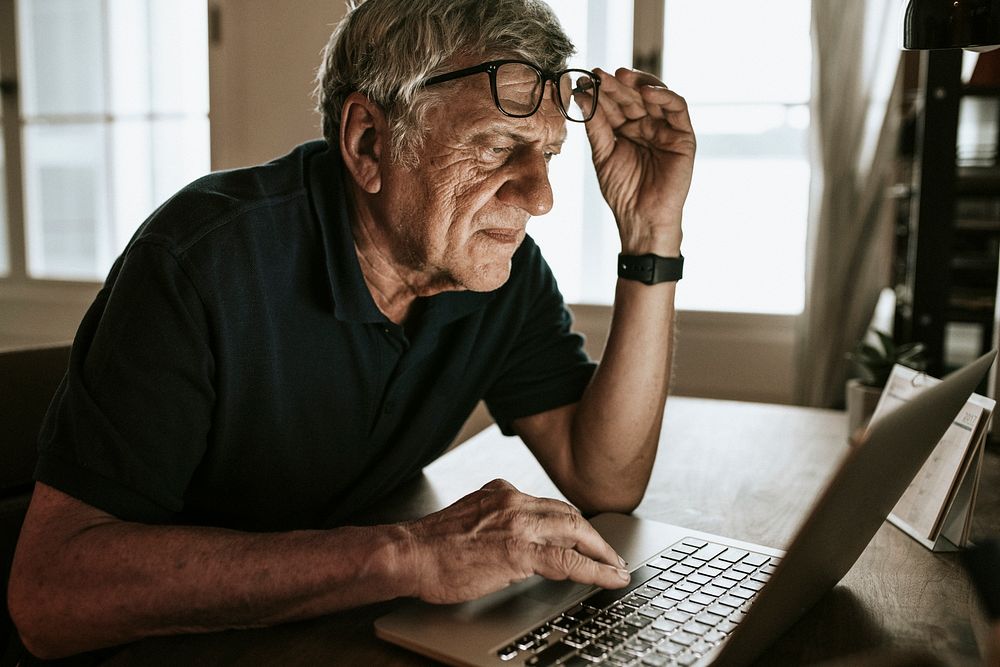 Senior man working on a laptop