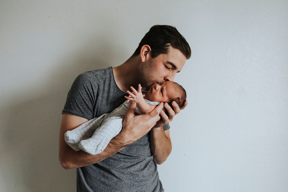 Young father holding his baby