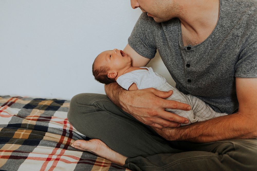 Young father holding his baby