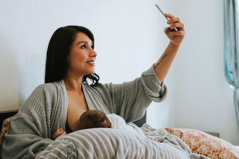 Breastfeeding mother taking a selfie