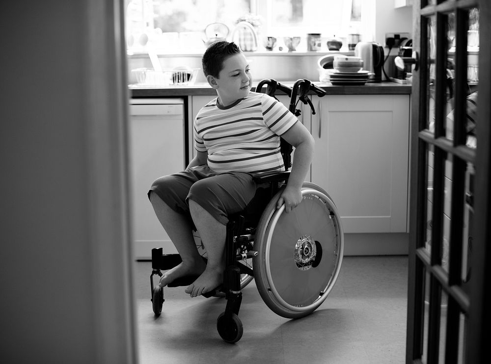 Happy boy in a wheelchair