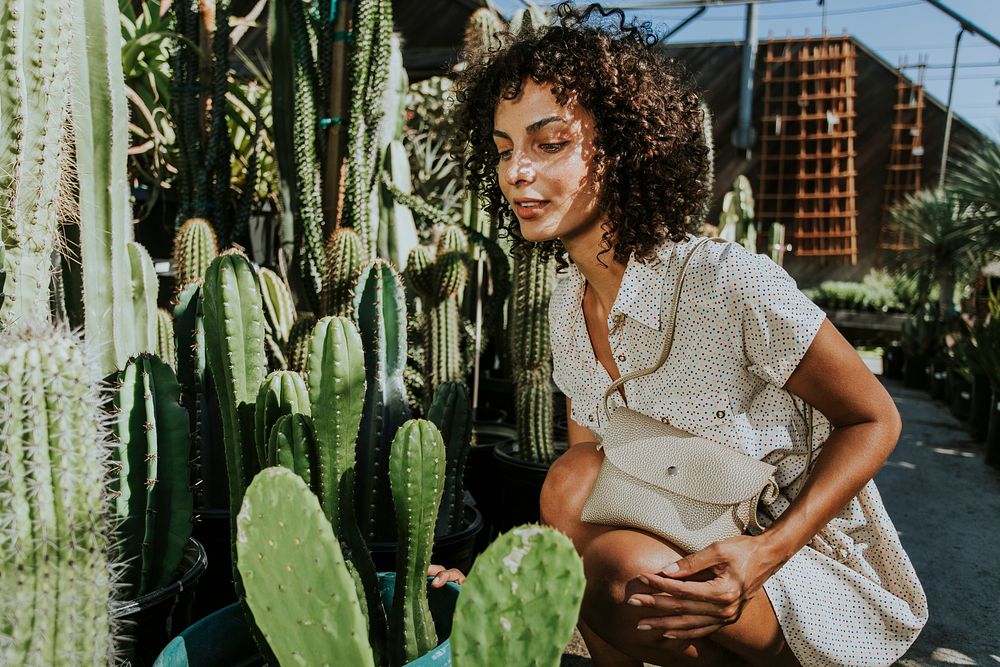 Beautiful woman at a cactus garden