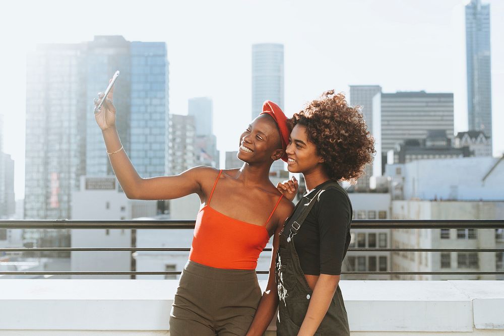 Girls taking a selfie at a rooftop