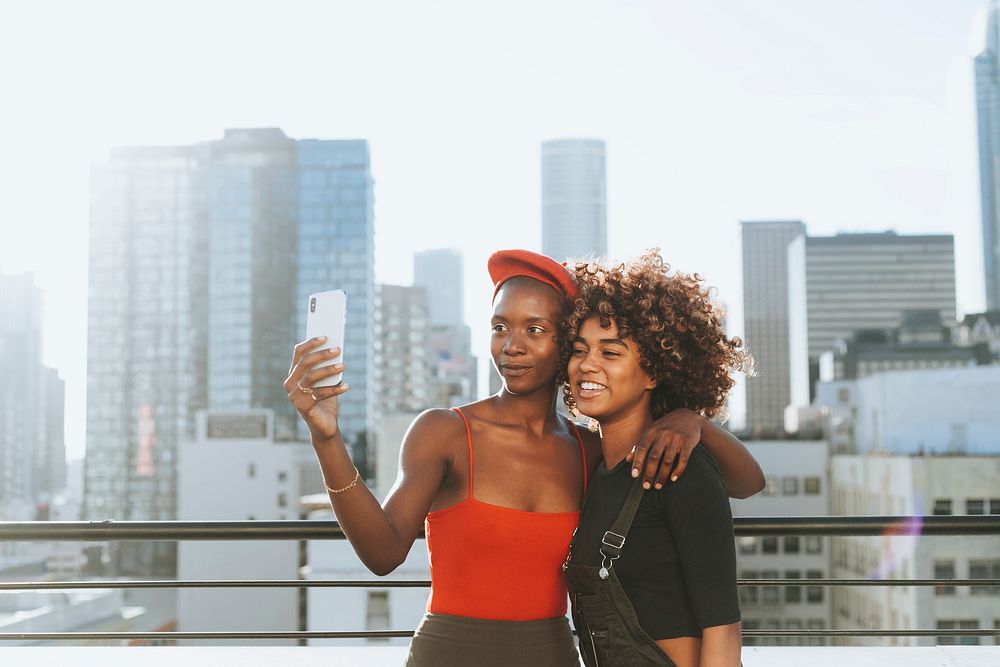 Girls taking a selfie at a rooftop