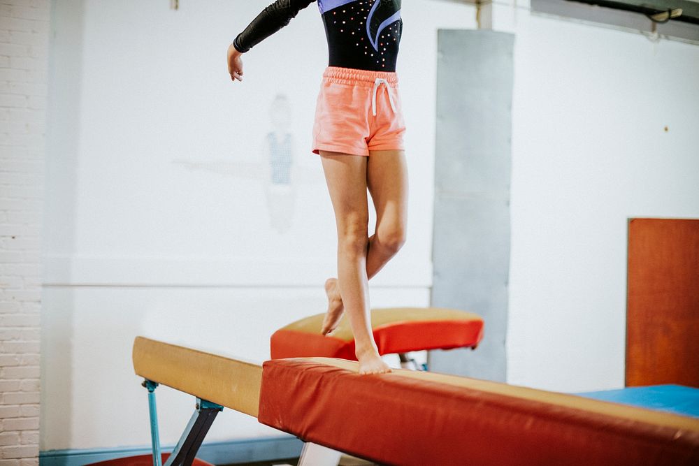 Young gymnast on a balance beam