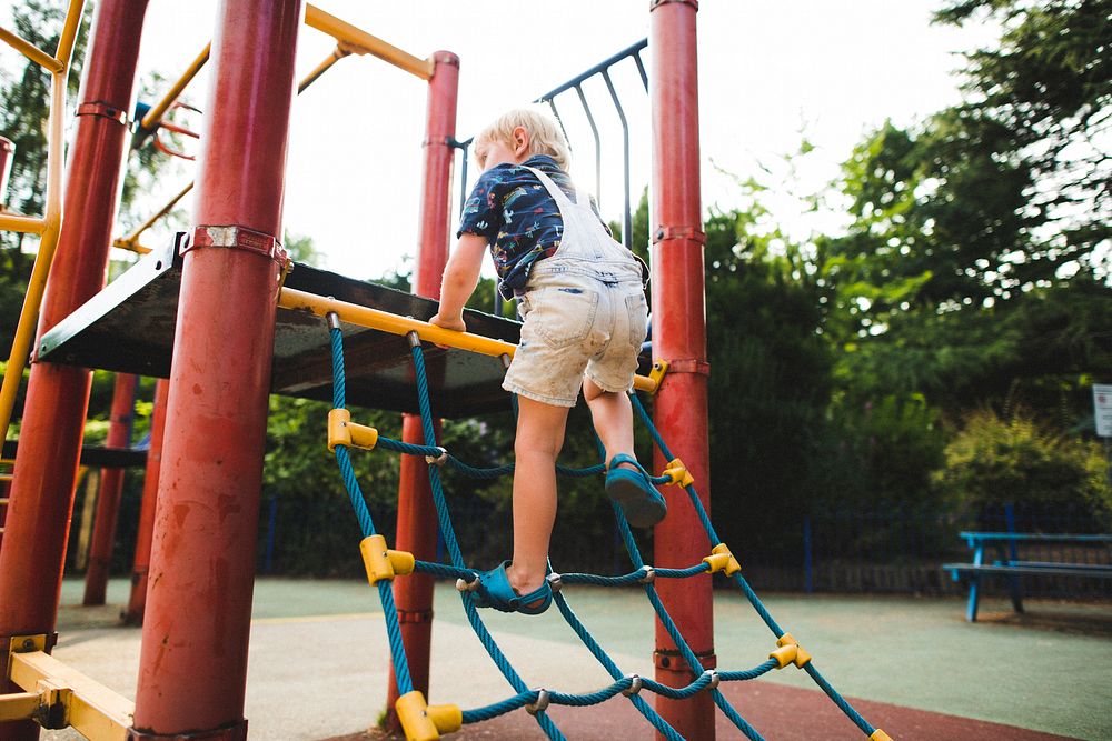 Young boy playing at a playground