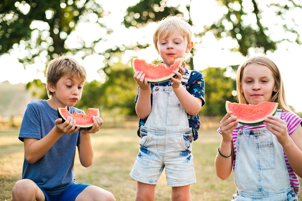 Kids eating watermelon