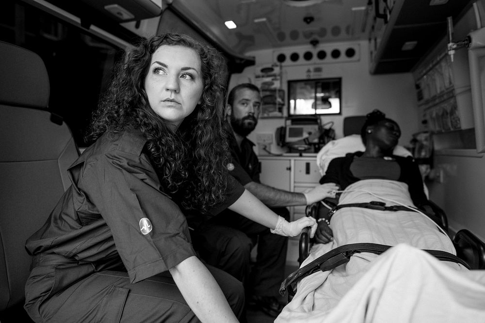 Paramedics with a patient in an ambulance