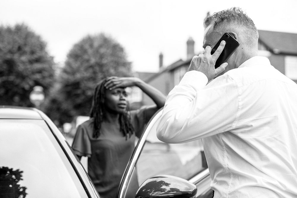 Man calling an insurance after a car accident