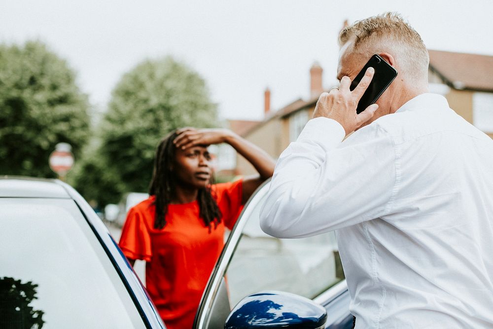 Man calling an insurance after a car accident