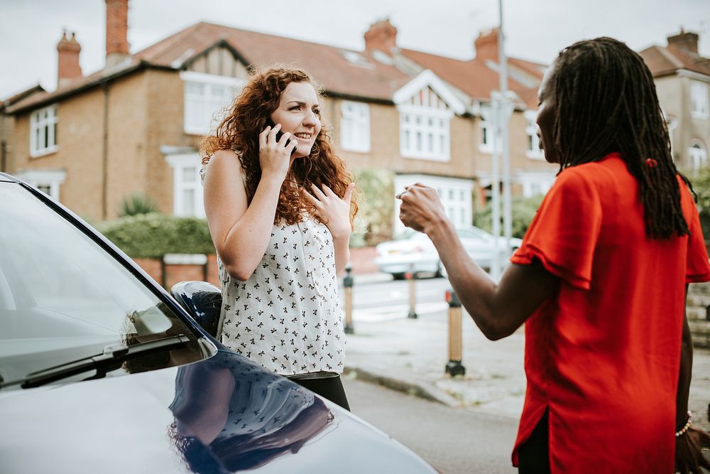 Women arguing after a car accident