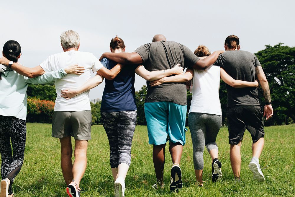 Group of people hugging in the park