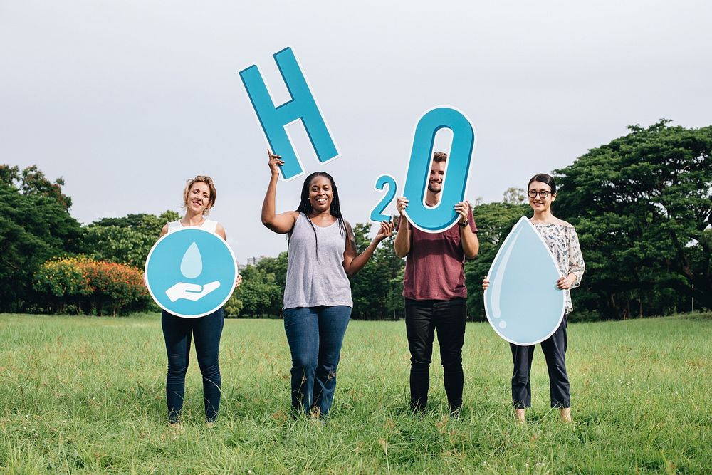 Cheerful diverse people holding H2O signs